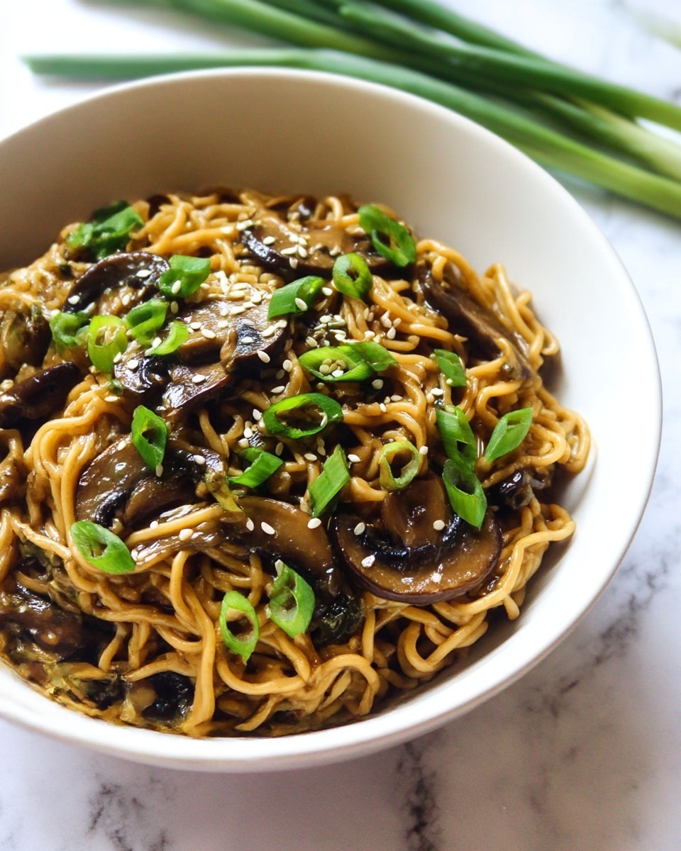 A white bowl filled with stir-fried noodles as the base layer, showing light brown, slightly shiny strands tangled together. Mixed within are thick slices of dark brown mushrooms and small pieces of green vegetables, primarily chopped green onions and sliced green peppers, scattered throughout. The dish is sprinkled with white sesame seeds on top, adding a textured detail. To the left, a metal fork is stuck in the noodles, and green onions lie blurred in the background on a white marbled surface. photo taken with an iphone --ar 4:5 --v 7