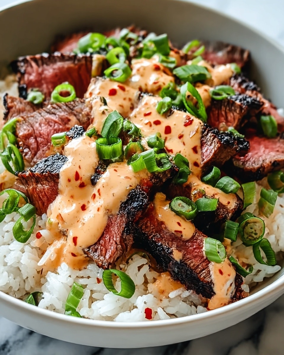 A close-up view of a bowl showing three main layers: at the bottom is fluffy white rice with a soft texture, topped with thick slices of grilled steak cooked to medium with a charred black crust and a juicy pink inside, drizzled generously with a creamy, light orange sauce speckled with red bits, and sprinkled on top with fresh, chopped green onions adding a bright green color, all inside a white bowl, placed on a white marbled surface. Photo taken with an iphone --ar 4:5 --v 7