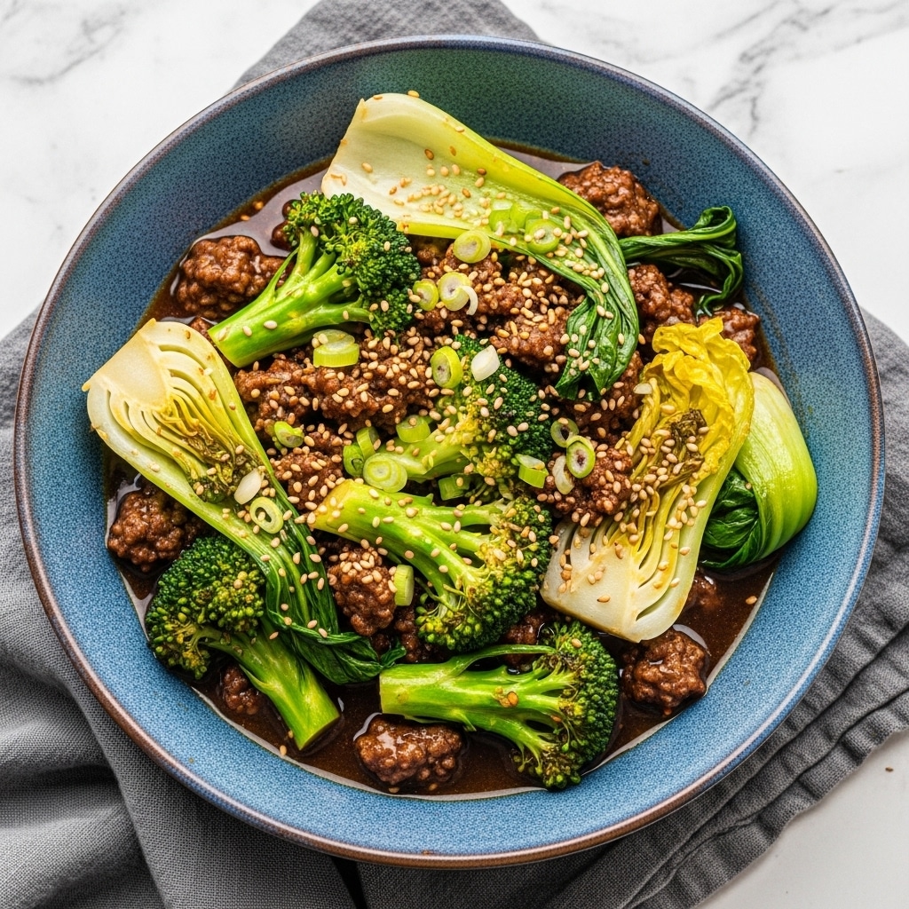 A white bowl filled with a beef and broccoli stir-fry sits on a white marbled surface. The dish has three main layers: at the bottom is a shallow layer of dark brown glossy sauce. The middle layer contains bright green broccoli florets and pale yellow chunks of cooked onion. The top layer is made of small pieces of browned ground beef mixed with chopped green onions and sprinkled with white sesame seeds, giving the dish some texture and color contrast. photo taken with an iphone --ar 4:5 --v 7