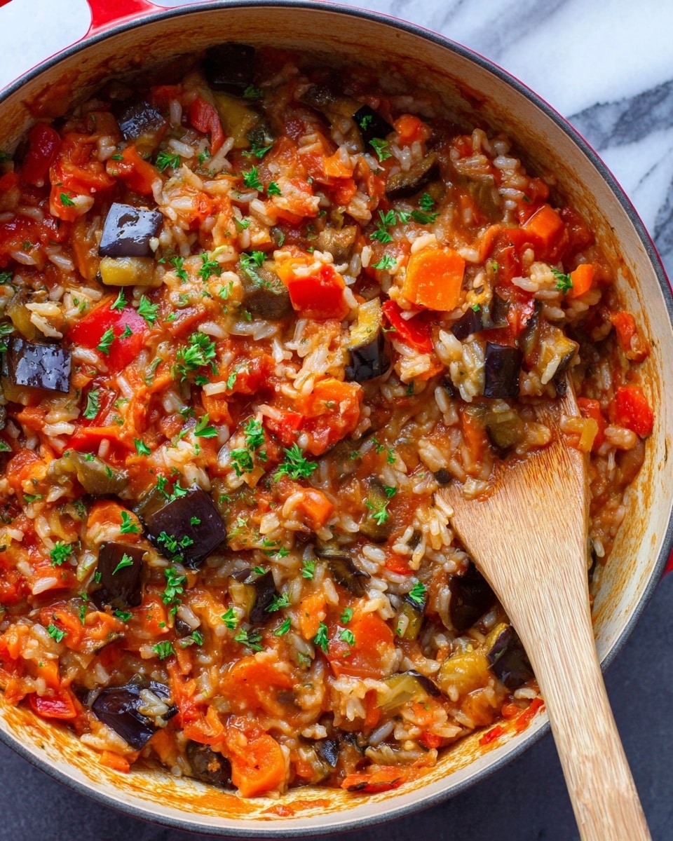A close-up view of a red pot filled with a cooked vegetable and rice stew, showing a mix of chunky orange carrots, red bell peppers, dark purple eggplant pieces, and soft white rice all combined in a saucy base with small green parsley garnishes sprinkled on top. A wooden spoon rests on the right side inside the pot, partially submerged in the thick, colorful mixture. The background is a white marbled texture. photo taken with an iphone --ar 4:5 --v 7