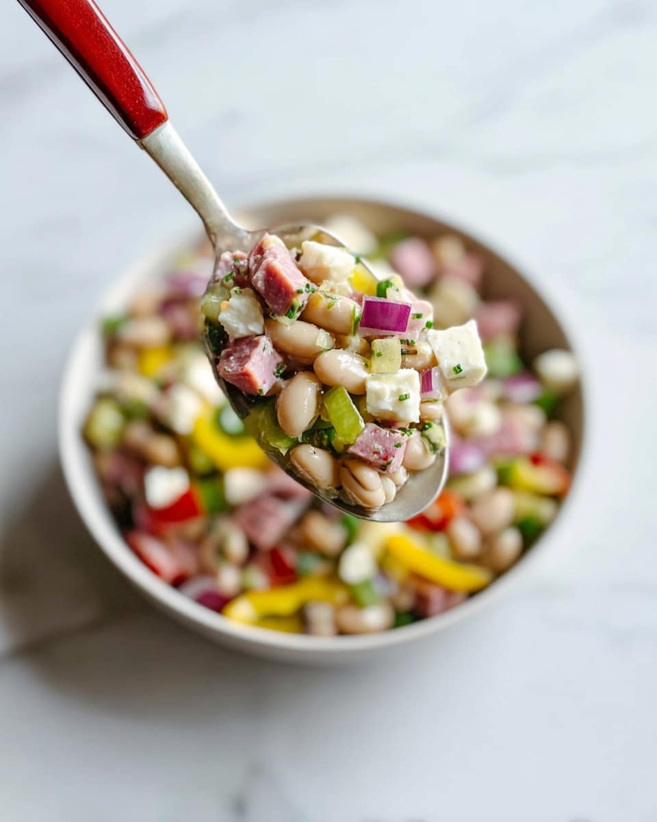 The image shows a close-up of a spoonful of a mixed bean salad held above a white bowl filled with the same salad. The spoon displays layers of small white beans, pink diced meat, green herbs, creamy white cheese cubes, chopped red onions, and small slices of light green pepper, all mixed together with a light dressing. The bowl beneath is filled with the same colorful mix, showing a blend of yellow pepper slices, red pieces, and green herbs on a white marbled surface. A red-handled fork holds the spoon. Photo taken with an iphone --ar 4:5 --v 7